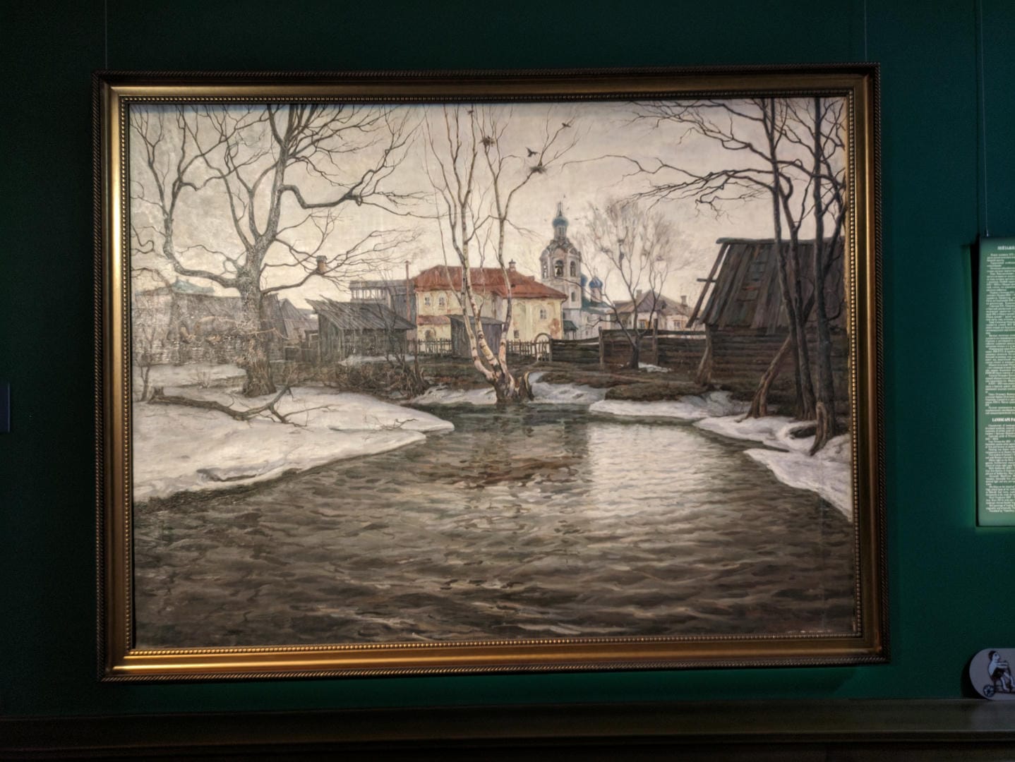 一幅描绘冬季乡村景色的画作,画面中有小溪、光秃的树木和雪地。