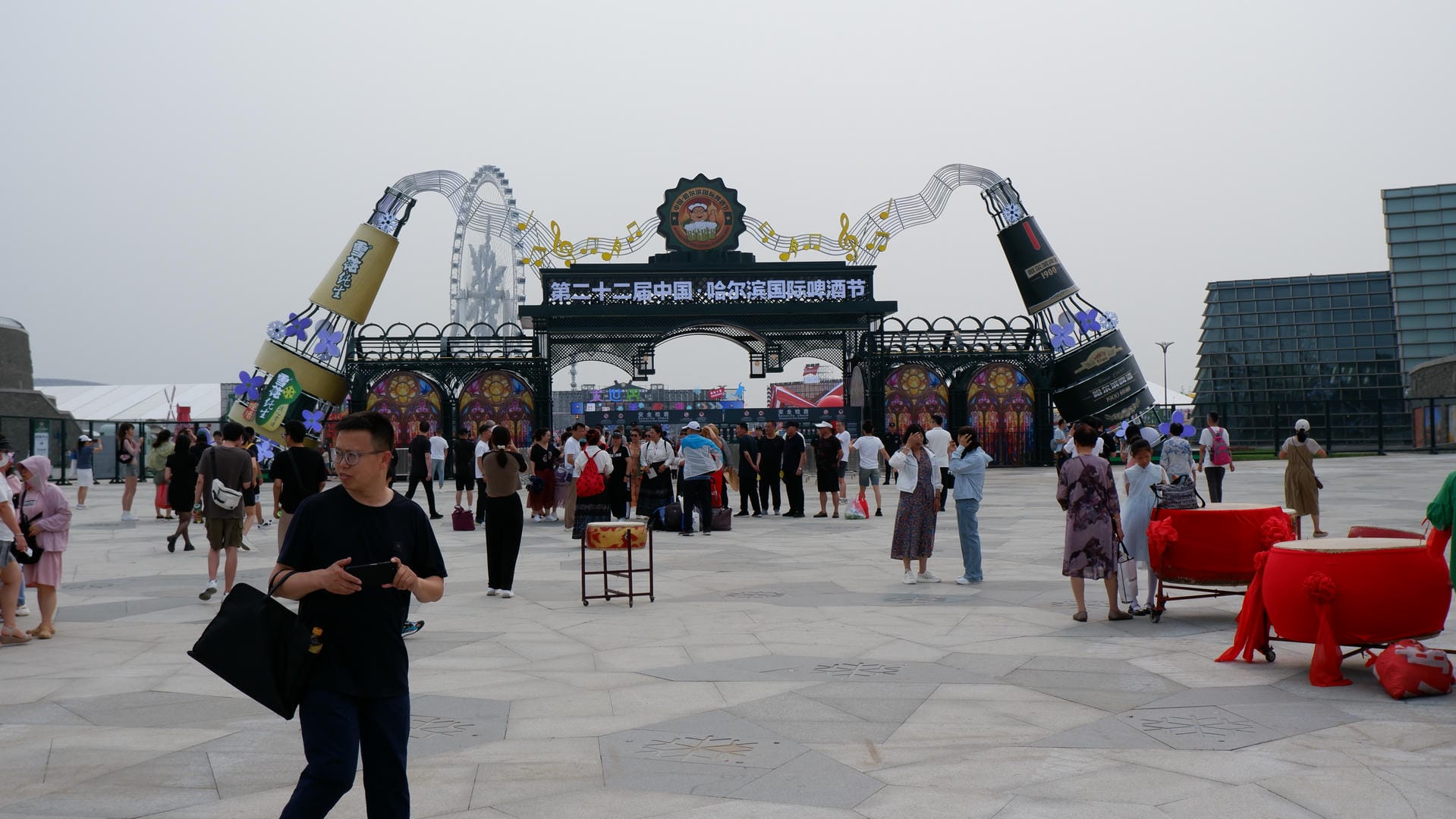there is a man standing in front of a large crowd of people